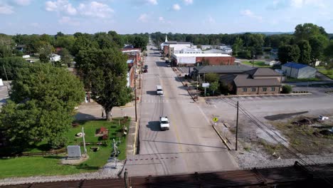 locomotive passes through cave city kentucky, freight train with boxcars aerial