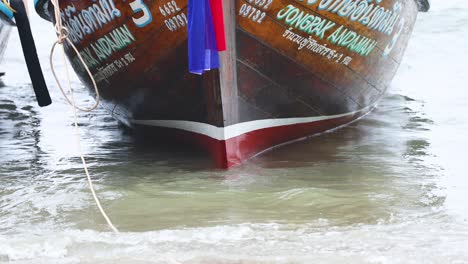 boat approaching shore in krabi, thailand