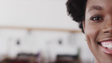 Portrait-of-happy-african-american-female-worker-in-workshop-in-jewellery-studio-in-slow-motion