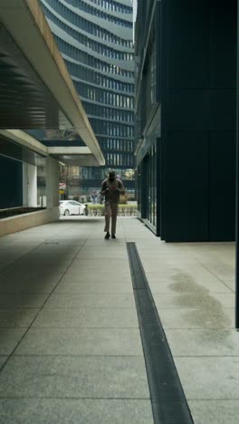 man walking in a city street