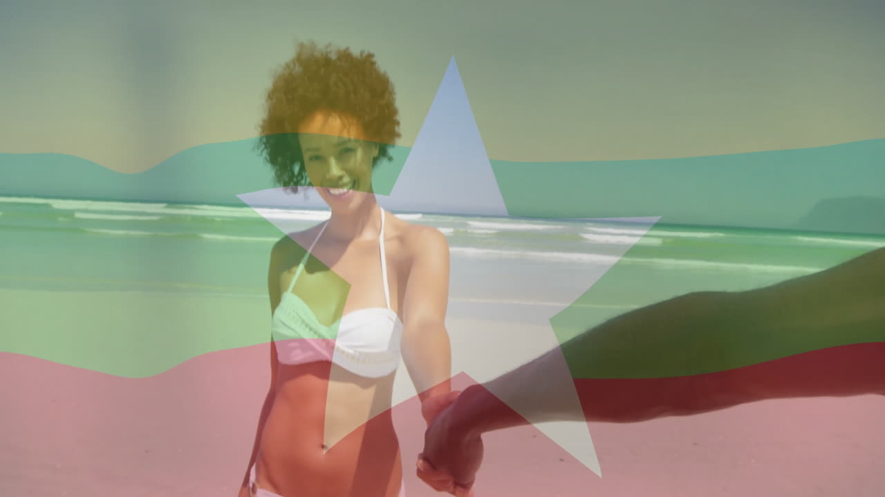 Holding hand on beach, woman in bikini with flag animation overlay