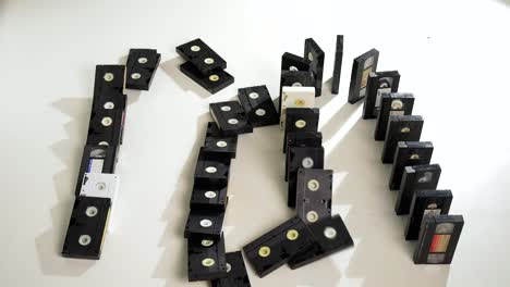 domino, stacked and tumbling vhs tapes