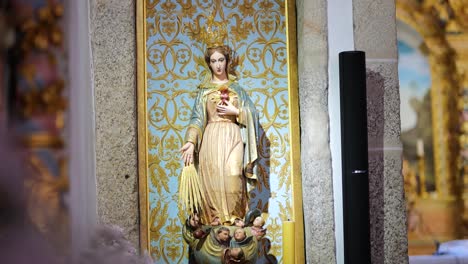 saint mary statue on altar inside portuguese catholic church – religious interior