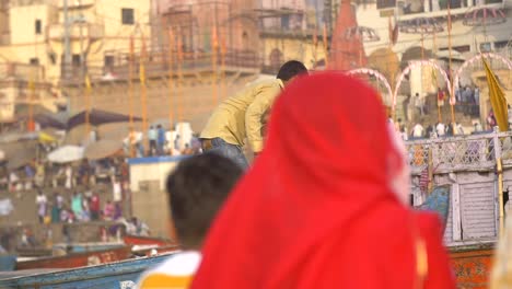 Man-Working-on-Small-Rowing-Boat