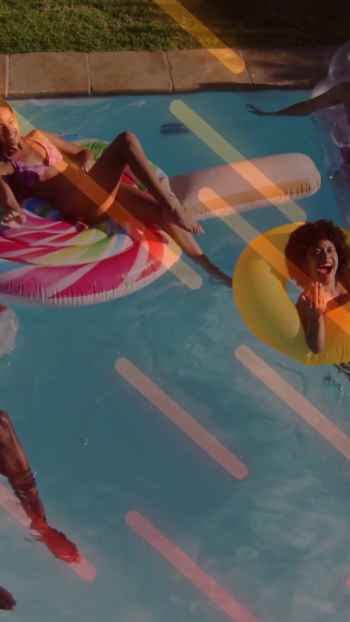 Reclining woman in purple bikini on candy tube in backyard-pool with yellow tube and diagonal light