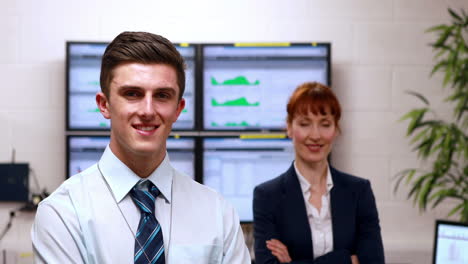 Data-center-colleagues-smiling-at-camera-in-office