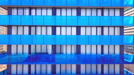 facade of a modern mirrored office building was removed from a drone. close-up