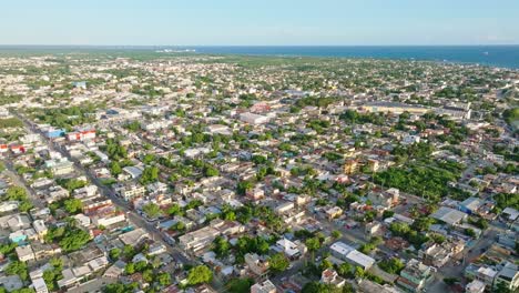 aerial forward panorama low-rise village san pedro de macoris in the caribbean