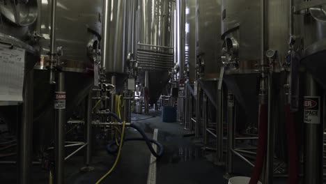 line of brew kettles for beer in a large brewery