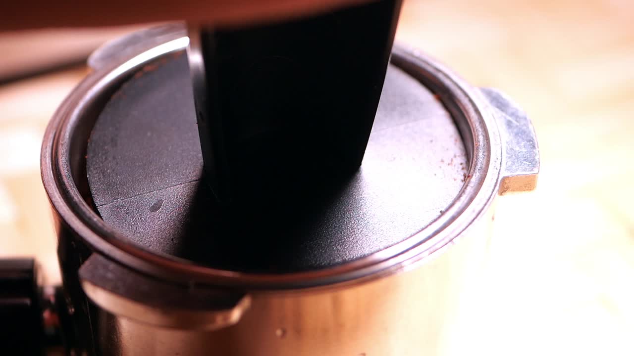 Tamping coffee in a portafilter