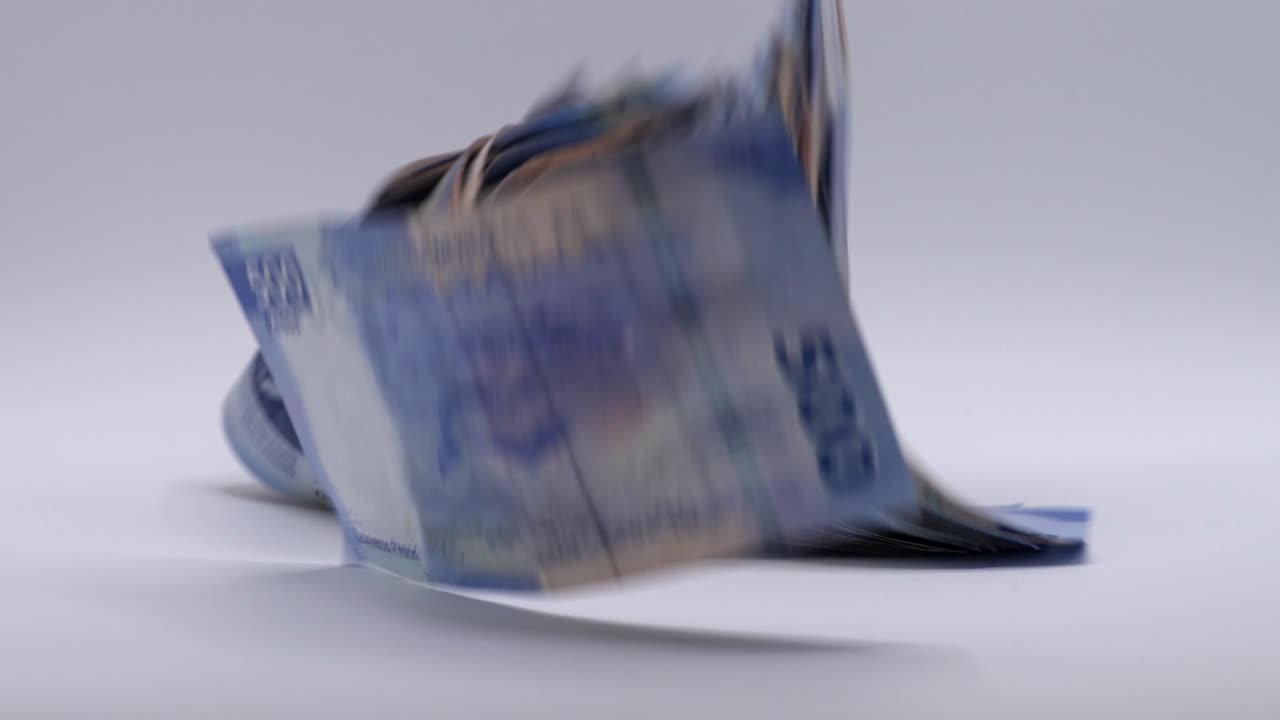 Mexican pesos Banknotes falling on a white background. Close up