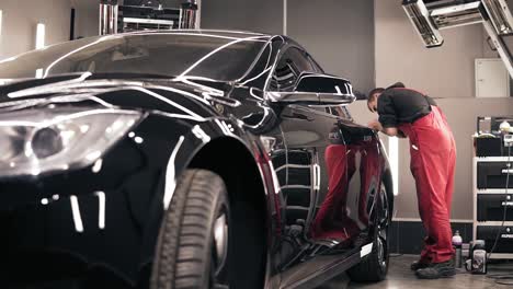 Process-of-polishing-stunning-new-black-car.-Slomotion-footage.