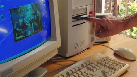 BARCELONA, SPAIN, 10 JUNE 2025. Man working and gaming on retro computer PC, IT engineer with vintage computer at home, using old fashion technology, close up of retro setup.