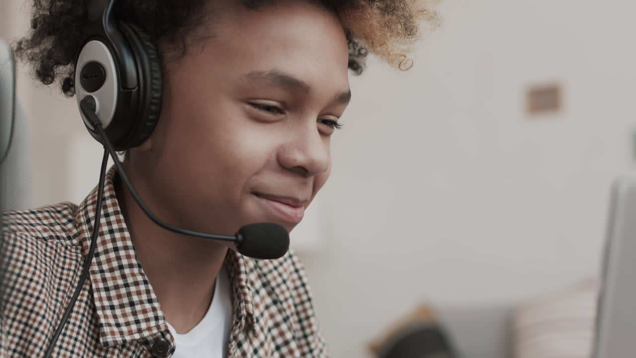 African Boy Wearing Headset Talking