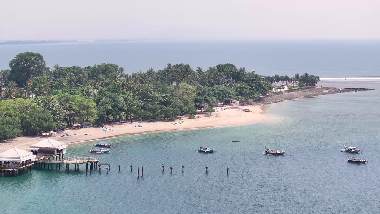 Senggigi Beach and ferry terminal on scenic Lombok coastal, Indonesia drone. Sunny day