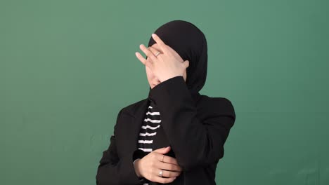 headache woman green background