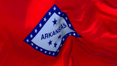 arkansas flag waving in wind slow motion animation . 4k realistic fabric texture flag smooth blowing on a windy day continuous seamless loop background.