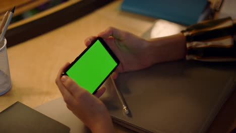 woman watching video on smartphone