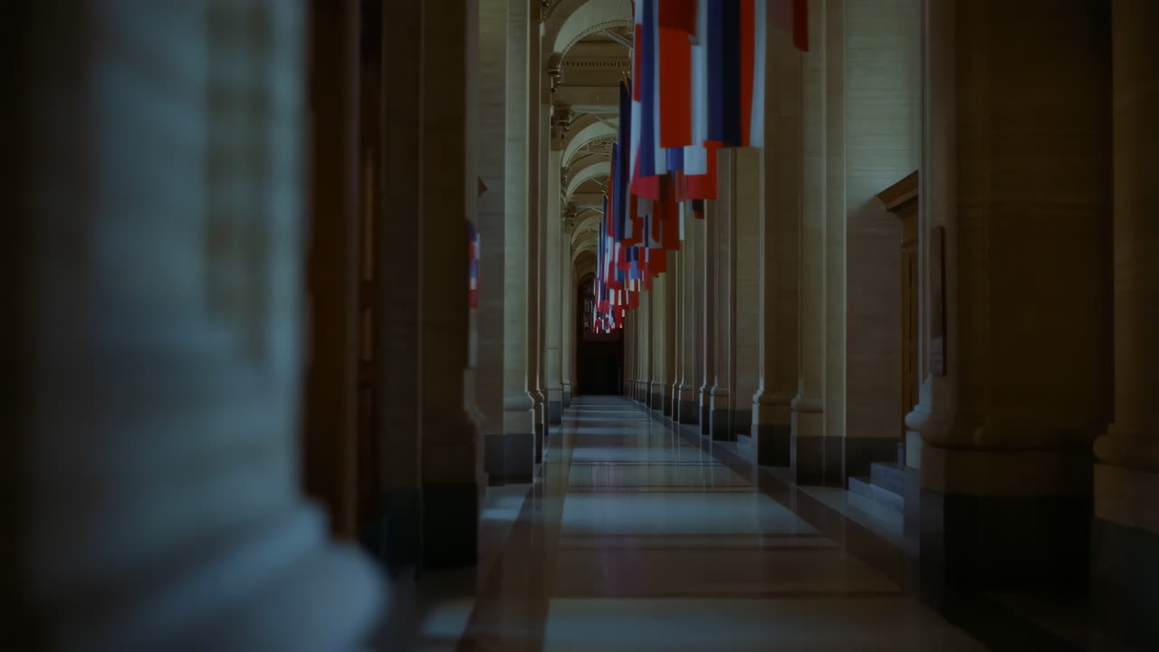 Grand Hallway with Pillars and Hanging Flags