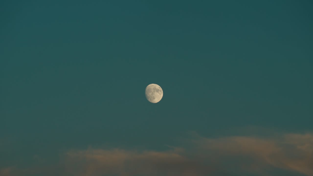 Waxing Gibbous Moon Against The Blue Sky. - wide shot