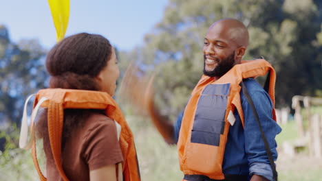 kayak, high five and couple by lake for rowing