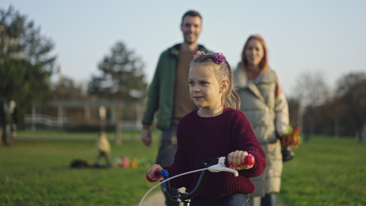 Family enjoying a bike ride in the park