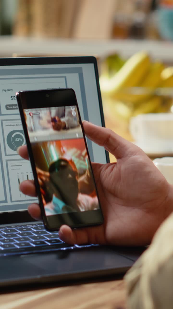 Vertical Video Remote worker watching social media videos on mobile app at home