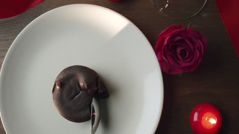 chocolate fondant cake on romantic dinner set up for valentine's day