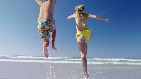 couple having fun together at beach on a sunny day