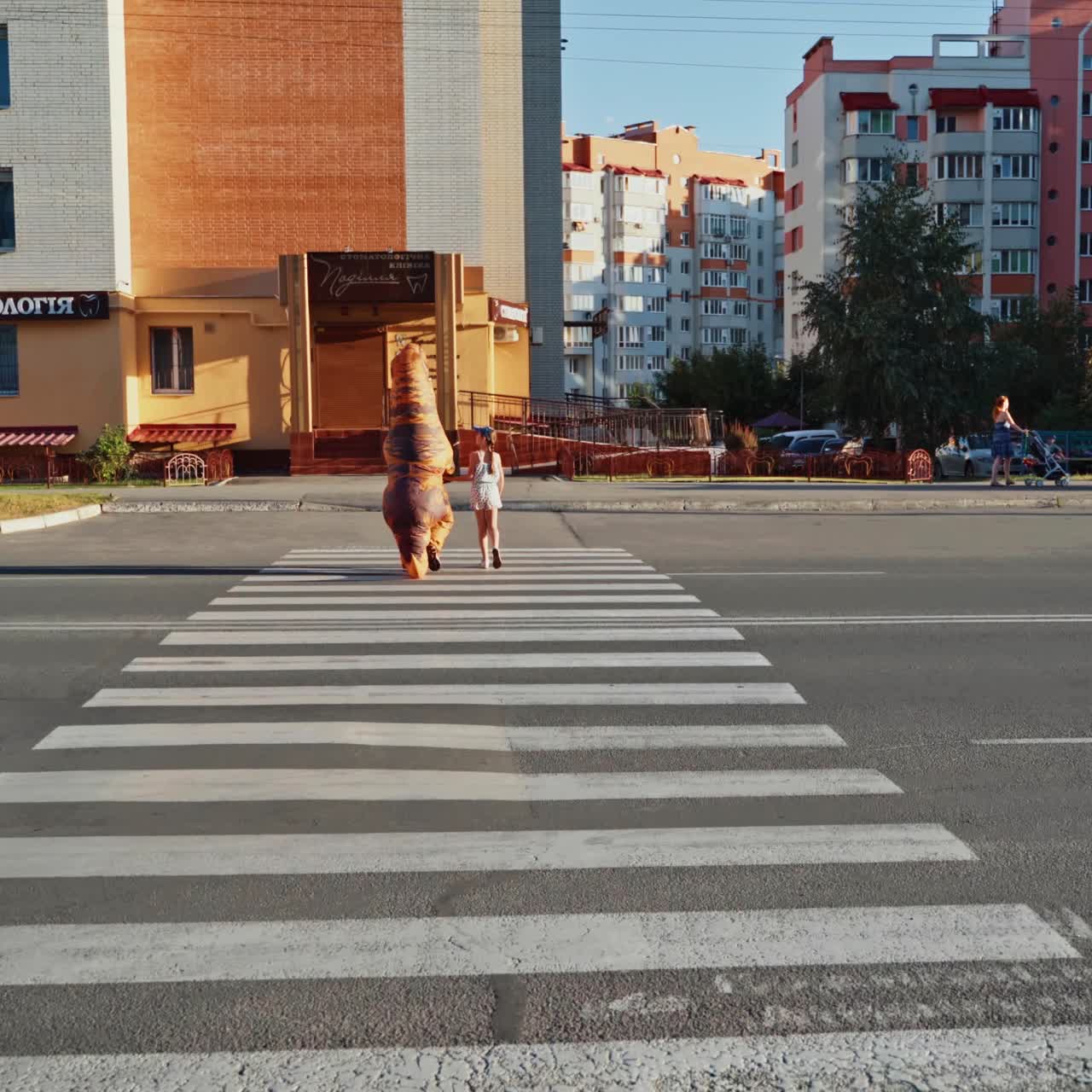 Girl walking with dinosaur