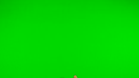 orange-with-green-background-throwing-up-orange-with-green-screen---green-background