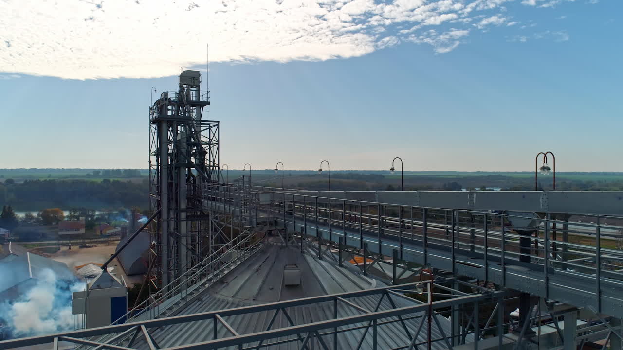 Modern industrial plant on nature background. Metal construction of agricultural factory. Exterior of large manufacture. Aerial view.