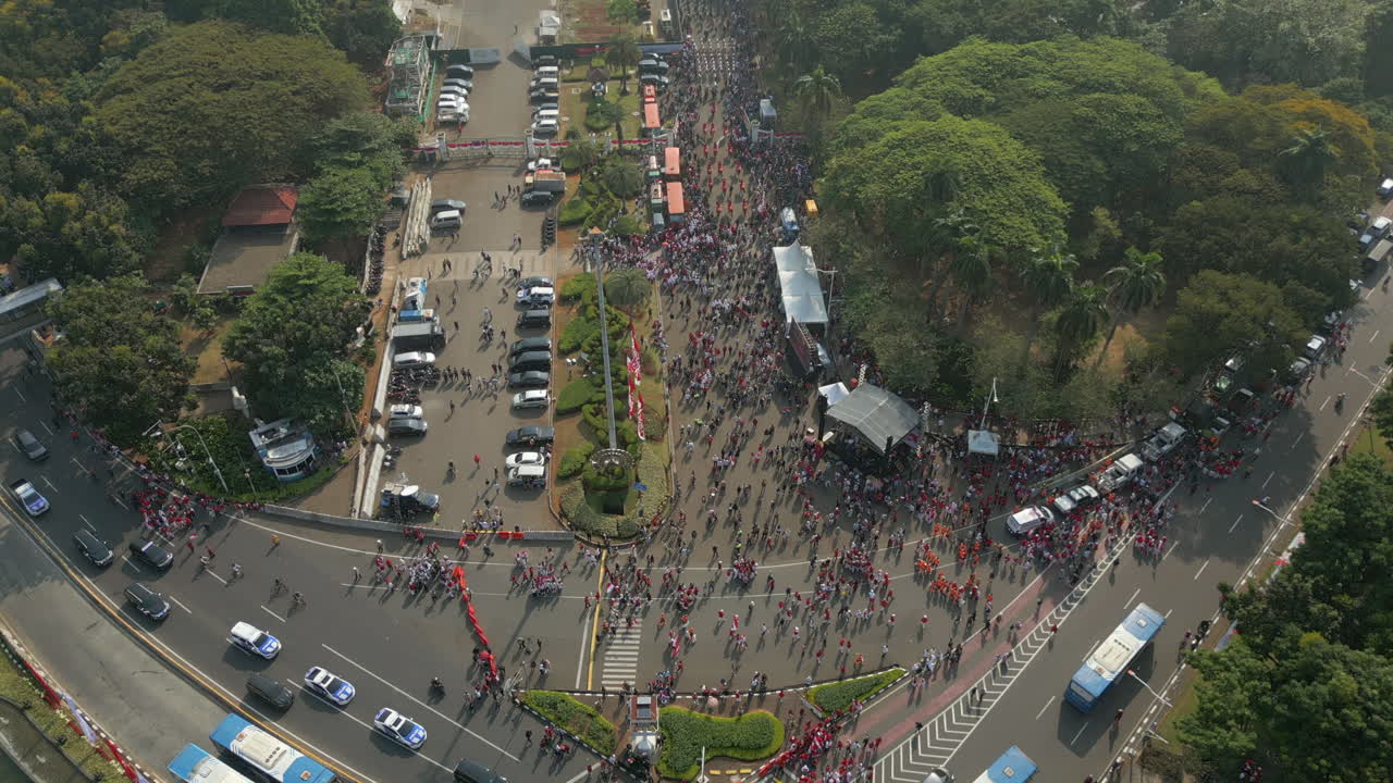 Indonesian People Gather For Independence Parade Near Thamrin Fountain Jakarta City Drone Static 4K 60FPS