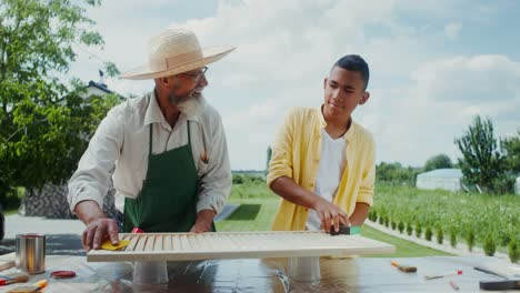 grandfather and grandson working together on a project