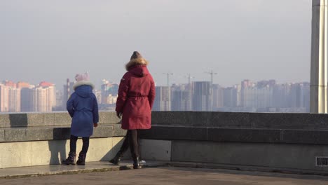 mother-daughter-on-top-of-the-roof-in-autumn