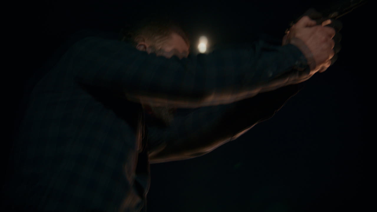 Man Walking at Night Under the Moon