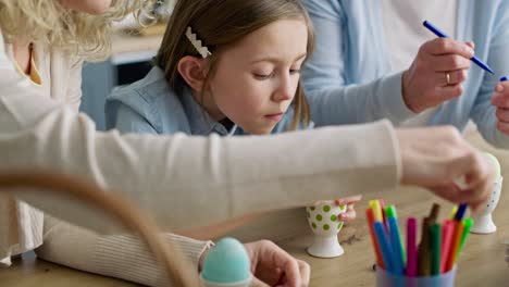 Video-of-three-generations-of-women-coloring-Easter-eggs