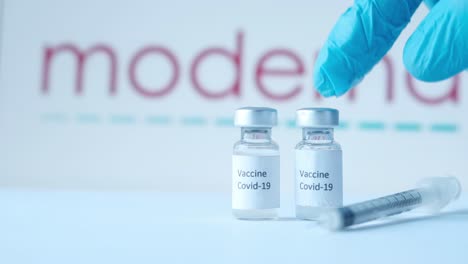 moderna covid-19 vaccine vials and syringe