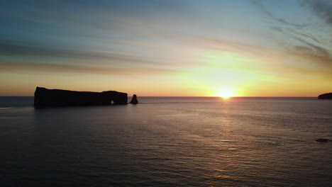 drone view at sunrise of famous perce rock in percé, québec, canada