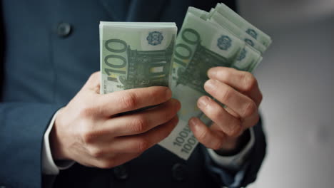 closeup hands calculating banknotes euro. man counting european currency cash.