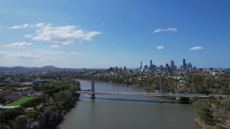 view of eleanor schonell bridge and brisbane skyline from dutton park in queensland, australia