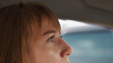 impatient young woman waits in traffic jam on hot day