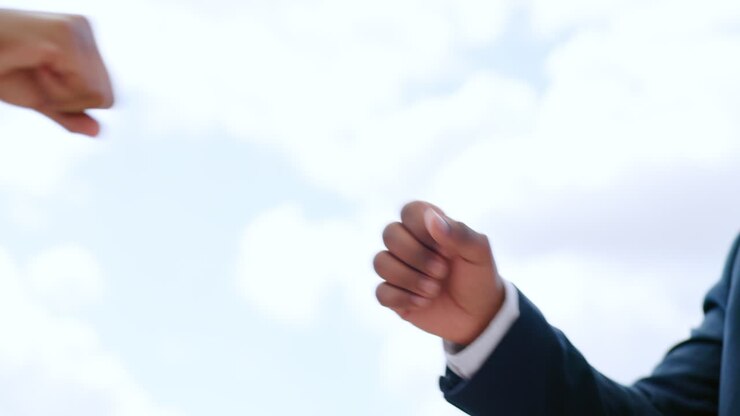 Handshake, fist bump and partnership with support