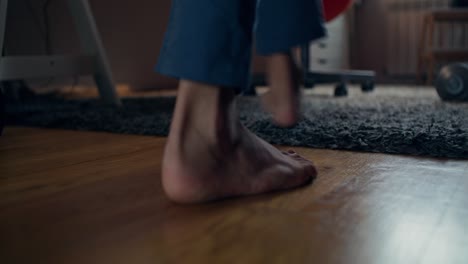 person getting up from a chair in a room