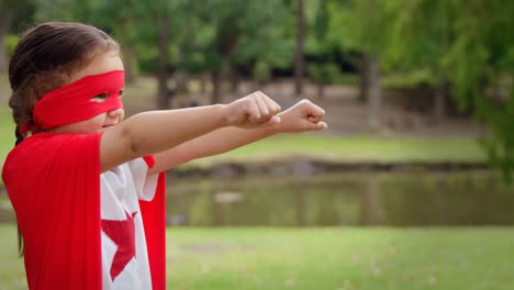 masked girl pretending to be superhero