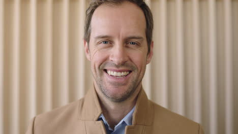 close-up-portrait-of-handsome-casual-businessman-laughing-happy-at-camera-confident-male-entrepreneur-enjoying-success