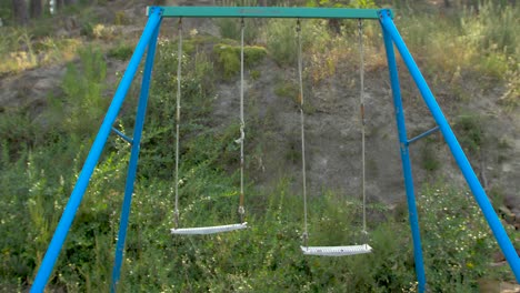 abandoned swing in a wild camp