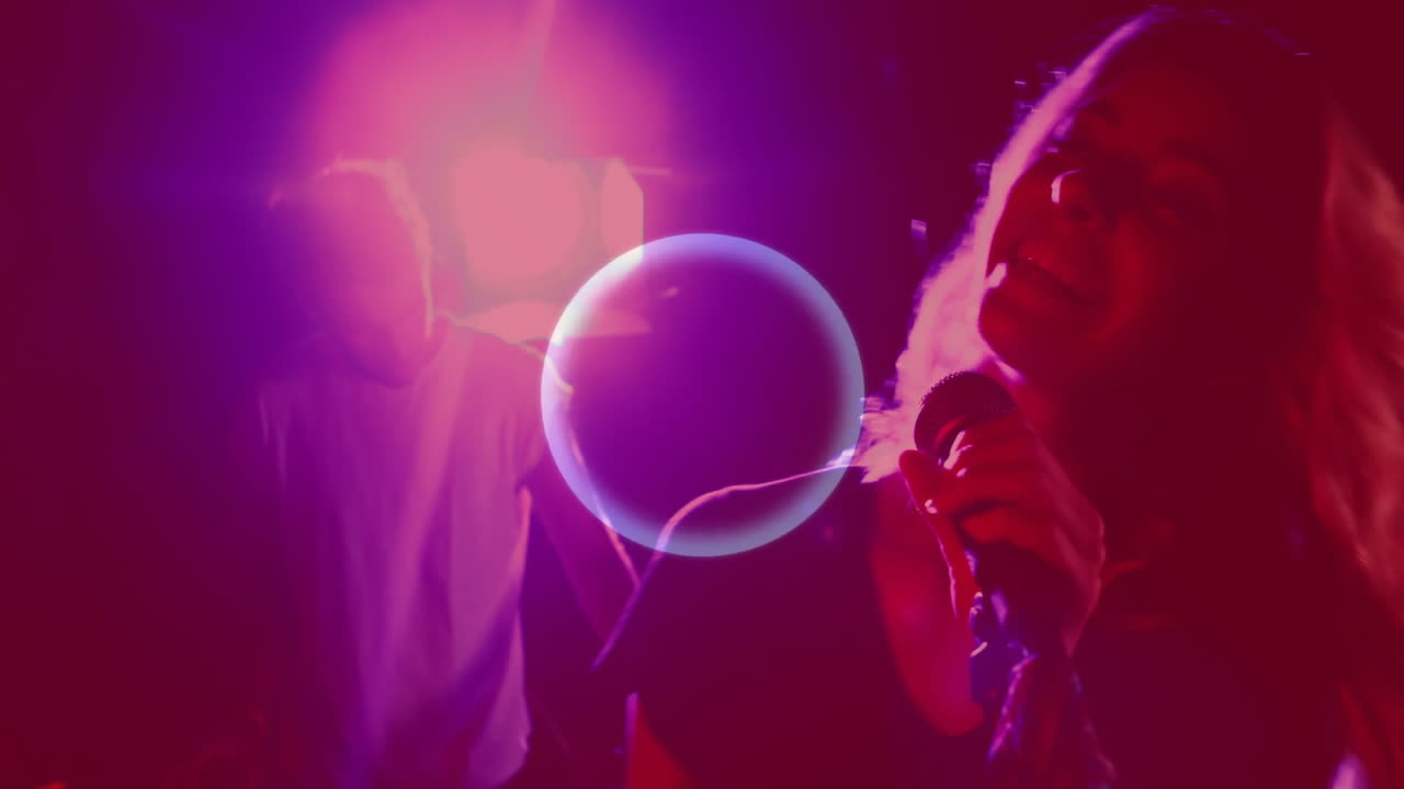 woman holding microphone promoting music in nightclub, featuring equalizer bars and neon trails