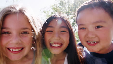 Group-Of-Children-With-Friends-In-Park-Running-Towards-Camera-Shot-In-Slow-Motion