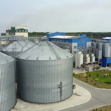 aerial view of metal grain elevator in agricultural zone. grain warehouse